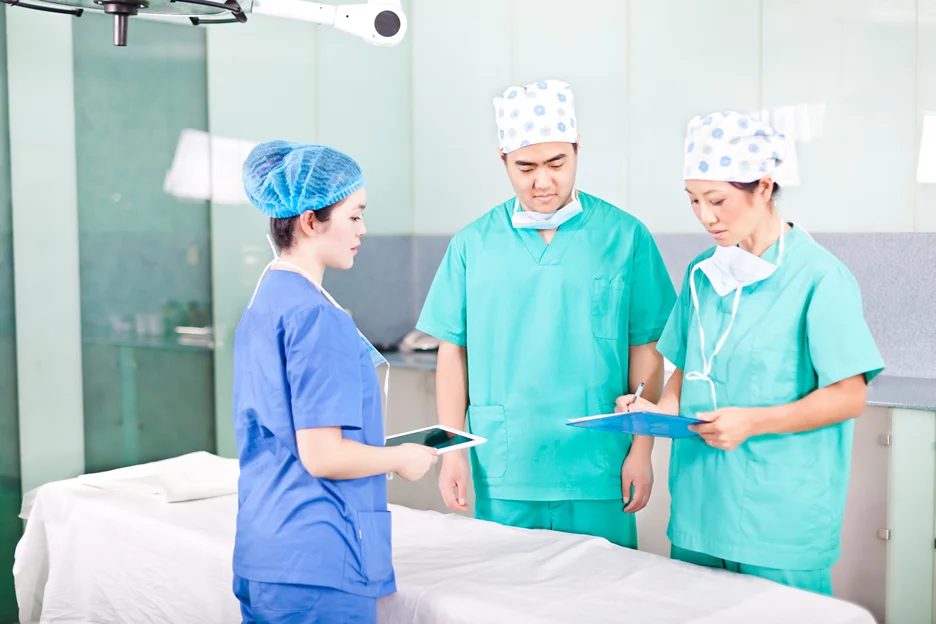 plastic surgeons discussing patient's case before surgery