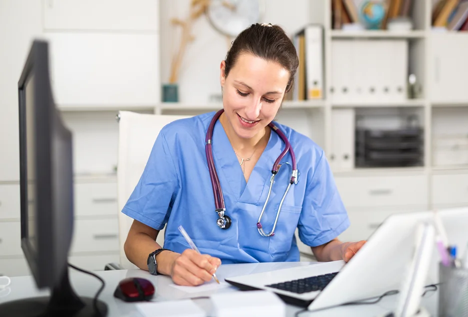 a medical doctor documents patient's health record in emr software