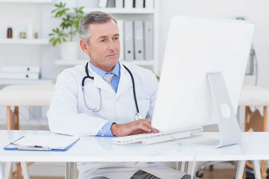 a medical doctor checking patients health records with emr