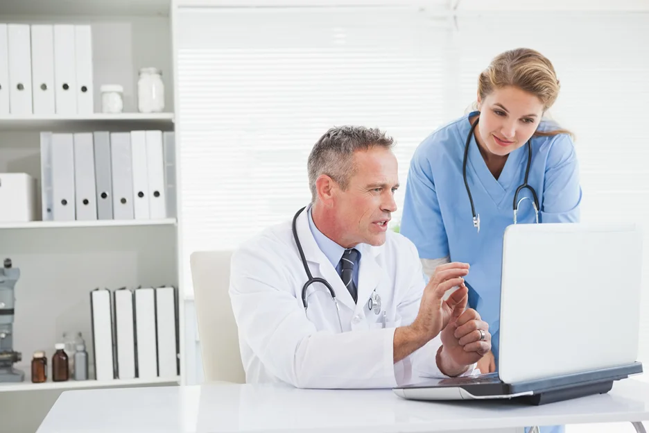 medical doctors checking patients record using EHR