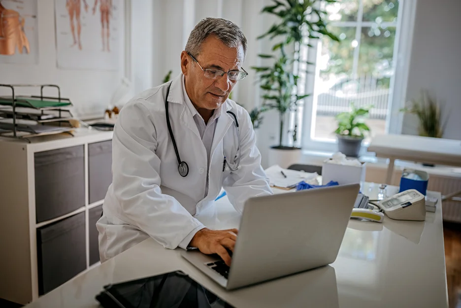 a doctor checking health records using ehr