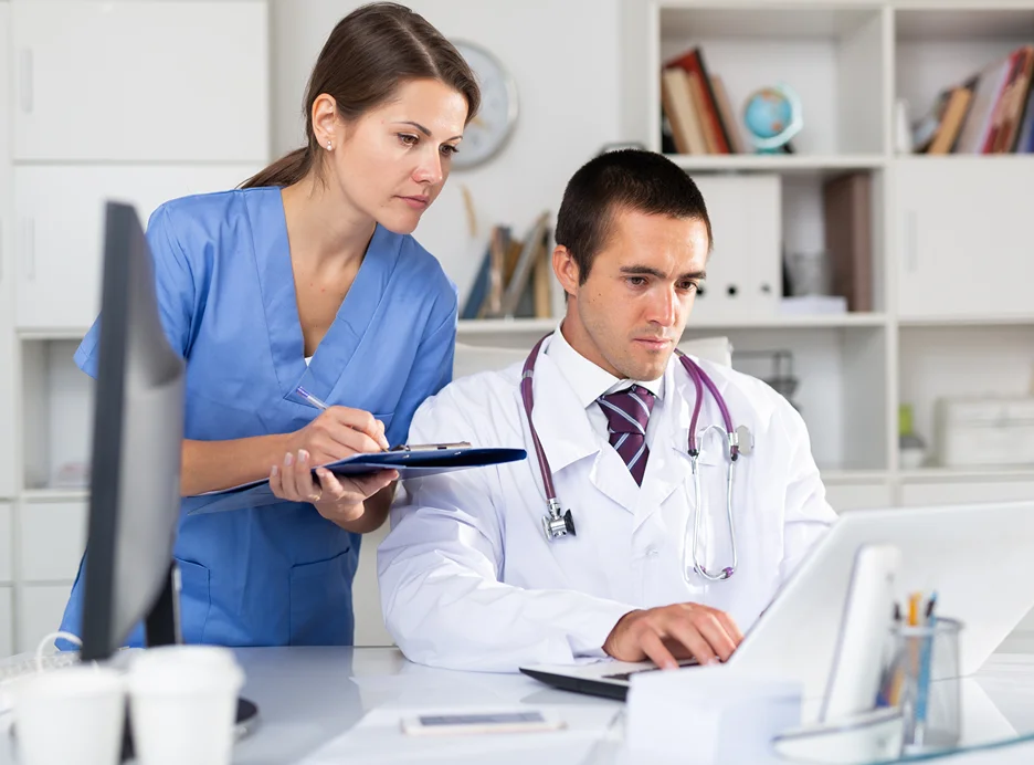 medical doctors checking health records using emr