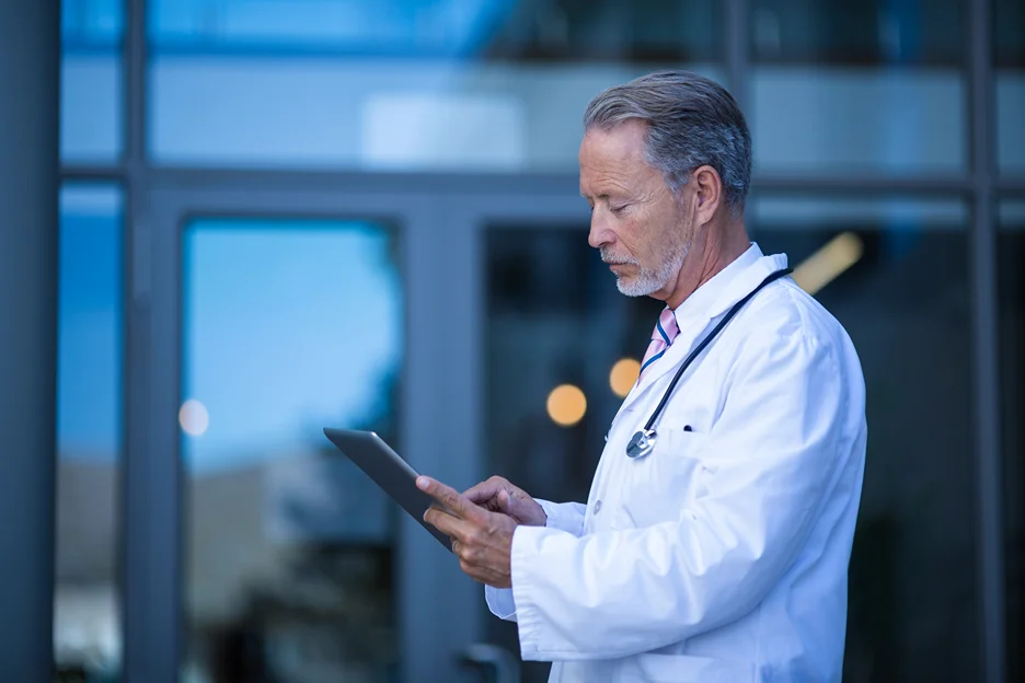 a doctor checking medical records using emr