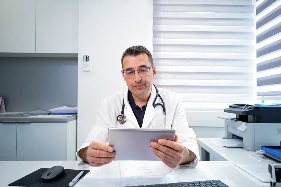 a medical doctor checking health records