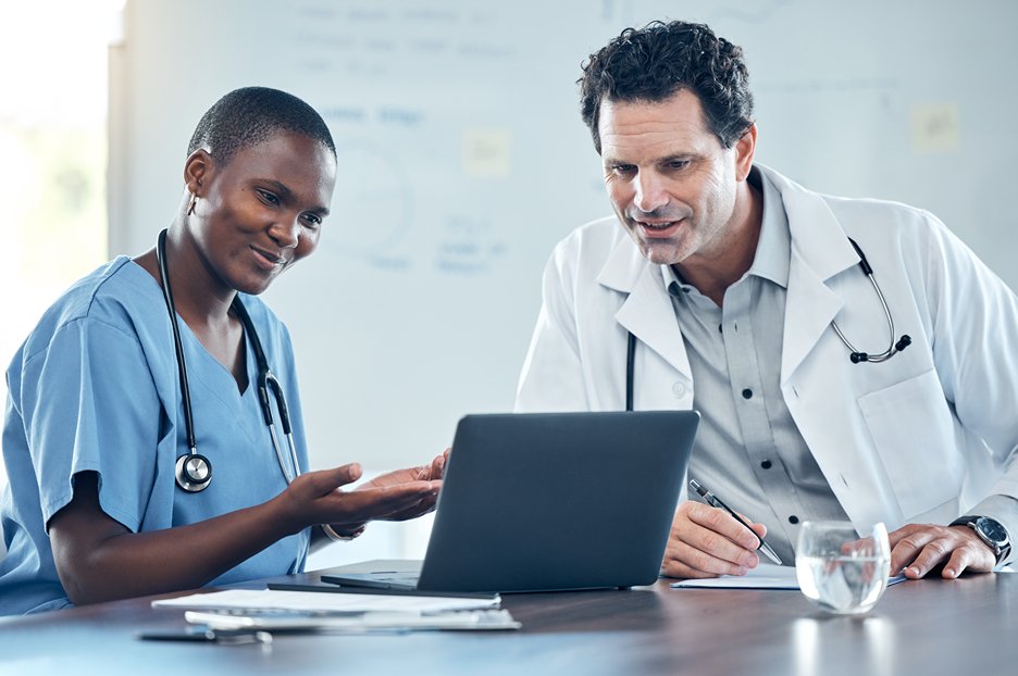 Medical Doctors checking health information from electronic device