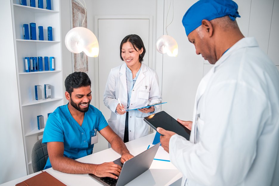 Medical doctors using their computer at work