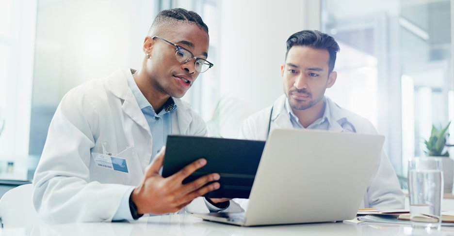 A Medical Doctor Checking Health Records from a electronic device